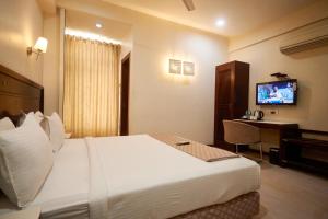 Postel nebo postele na pokoji v ubytování Hotel Sai Mahal + 32 fotografií