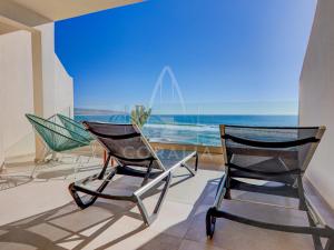 two chairs in a room with a view of the ocean at Illy - Ocean by Coralia - 4 Px in Taghazout +18 photos