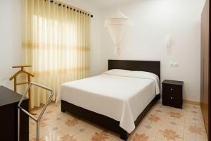 Ένα ή περισσότερα κρεβάτια σε δωμάτιο στο White Villa