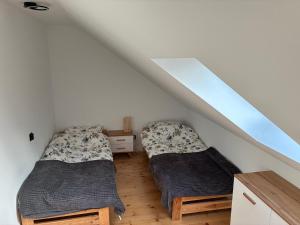 Postel nebo postele na pokoji v ubytování Apartament na lipowej