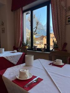 Postel nebo postele na pokoji v ubytování Hotel Garni Suisse