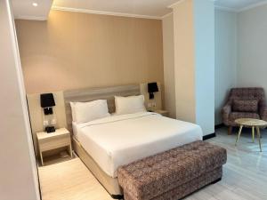 Postel nebo postele na pokoji v ubytování Bentark Hotel