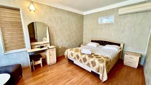 Postel nebo postele na pokoji v ubytování Garden Sheki