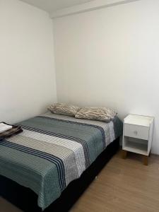 Ένα ή περισσότερα κρεβάτια σε δωμάτιο στο SUITE Ponta Negra