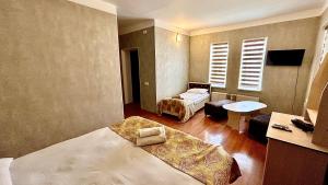 Postel nebo postele na pokoji v ubytování Garden Sheki