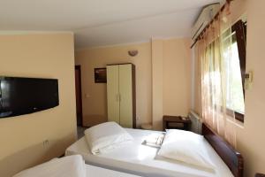 Postel nebo postele na pokoji v ubytování Apartments & Accommodation Stojic