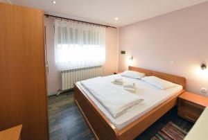 Postel nebo postele na pokoji v ubytování Apartments & Accommodation Stojic