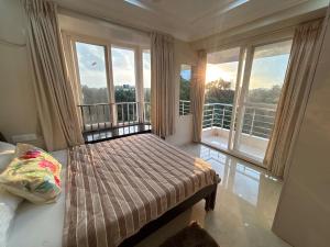 En eller flere senge i et værelse på Goldstone - Kudrat's Nilaya with pool + 13 billeder