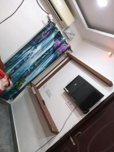 Et tv og/eller underholdning på Garuda Grand