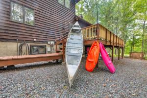 a group of three kayaks sitting next to a house at Large Family Friendly House on the Fairway Hideout in Lakeville