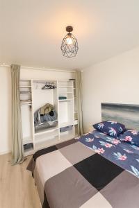 a bedroom with a bed and a window at Ducastel F2 Appartment in Juvisy-sur-Orge