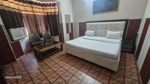 Ένα ή περισσότερα κρεβάτια σε δωμάτιο στο Hotel Asia Palace +6 φωτογραφίες