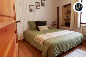 En eller flere senge i et værelse på Chalet en Provence avec terrasse dans le village