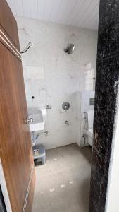a bathroom with a sink and a toilet at Friendz Villa in Igatpuri