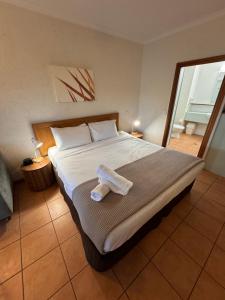 Postel nebo postele na pokoji v ubytování Barefoot Retreat Port Douglas