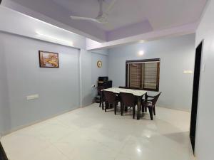 a dining room with a table and chairs at Friendz Villa in Igatpuri +11 photos