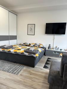 En eller flere senge i et værelse på CENTRAL Apartment