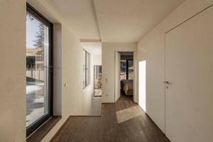 a hallway of a house with a large window at Mountain air Legit in Palyanytsya +11 photos