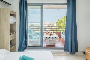 Postel nebo postele na pokoji v ubytování Studio - Front de mer Saint-Pierre - Wiskeys