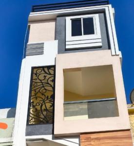 a building with a window on the side of it at KeshavShree home stay in Ujjain