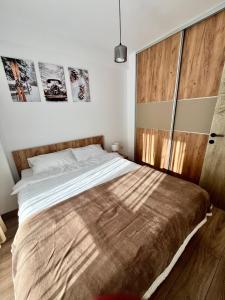 Postel nebo postele na pokoji v ubytování Titik Apartments Mavrovo
