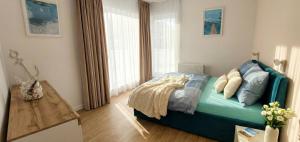 Postel nebo postele na pokoji v ubytování Mazurski relax plus Taras Garaż podziemny