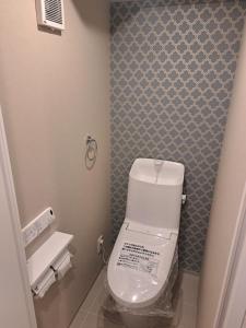 Koupelna v ubytování 専用温泉付き客室103 + 4 fotografie