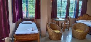 Giường trong phòng chung tại Ekora Resort