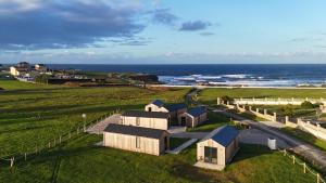 an aerial view of a house on the beach at Cabañas Camiño do Mar in Foz