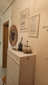 a room with a dresser and a mirror on the wall at Paradiso de Playa LaMata in La Mata