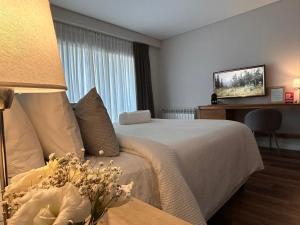 En eller flere senge i et værelse på Soar Luxury Studio en el centro de Salta