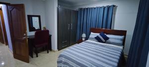 Un pat sau paturi într-o cameră la Purple Springs Elmina #1