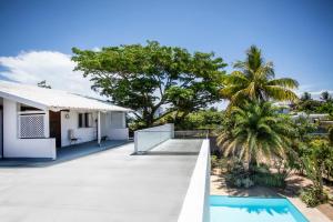 an image of a house with a swimming pool at Private Villa Azure Garden with pool in Grand Baie