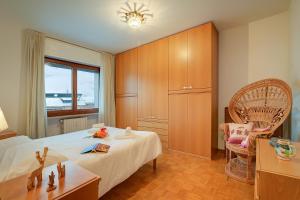 Postel nebo postele na pokoji v ubytování Appartamento Vista Alta - Happy Rentals