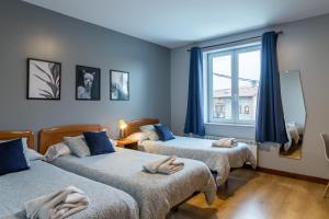 Ένα ή περισσότερα κρεβάτια σε δωμάτιο στο Hostal La Concha en Somo