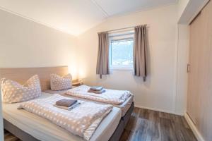 En eller flere senge i et værelse på Charmantes Tiny House in Güls