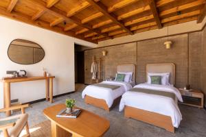 Postel nebo postele na pokoji v ubytování The Doksa