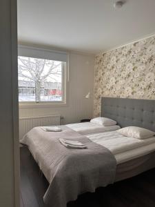 Postel nebo postele na pokoji v ubytování Motell Fyra Hästar