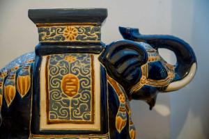 a blue and gold vase sitting on a table at 3 Bed Traditional Apartment on Picturesque Victoria St in Edinburgh +14 photos