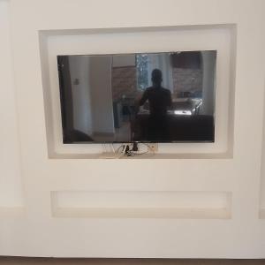 a picture of a person in a mirror in a white frame at majaoni villa in Mombasa +11 photos