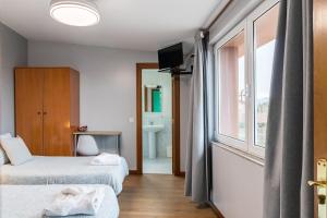 Μια τηλεόραση ή/και κέντρο ψυχαγωγίας στο Hostal La Concha en Somo