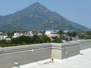 a view of a mountain from the roof of a building at TADY Homes in Tiruvannāmalai