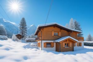 een houten huisje in de sneeuw met de zon op de achtergrond bij Appartement La Creusettaz Happy Rentals in Chamonix-Mont-Blanc