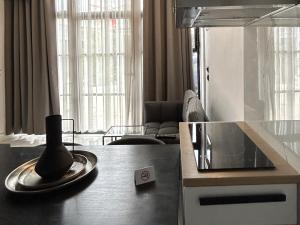 a living room with a table with a vase on it at NEKTAR home in Latsídha +72 photos