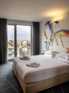 Postel nebo postele na pokoji v ubytování Nobel Zira Hotel