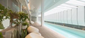 a large building with a swimming pool in the middle at Seis Residences in Quito