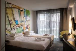 Postel nebo postele na pokoji v ubytování Nobel Zira Hotel + 46 fotografií