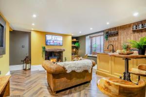a living room with a couch and a fireplace at 1 Bed in Holmfirth oc-c33380 in Holmfirth