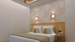 En eller flere senge i et værelse på Hotel Urania Arenal - Adults Recommended