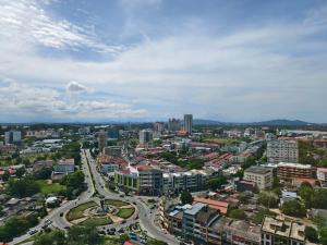 an aerial view of a city with buildings and roads at Cocasa Homestay 1 in Kuala Terengganu
